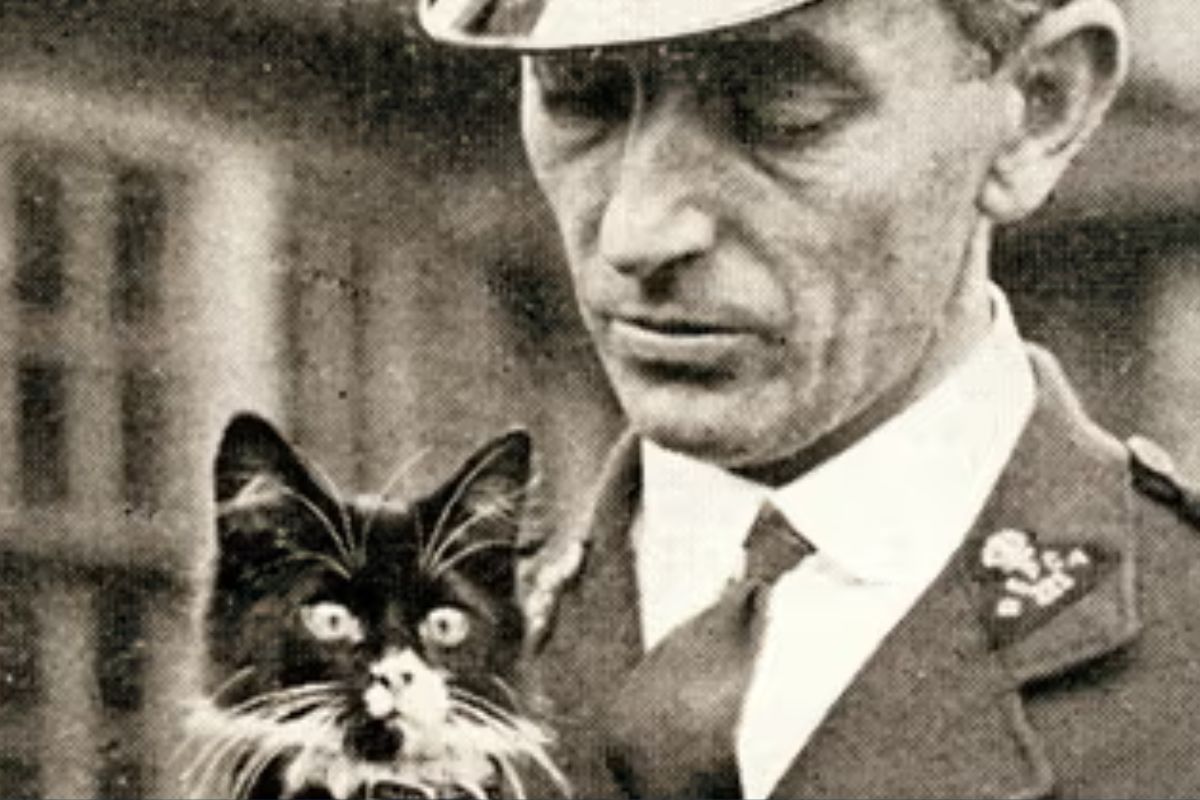 An early member of the RSPCA holding a pussy cat!